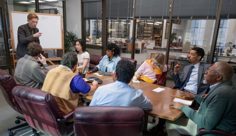 Ned (Domhnall Gleeson) address the Toledo Truth Teller employees in the conference room in The Paper