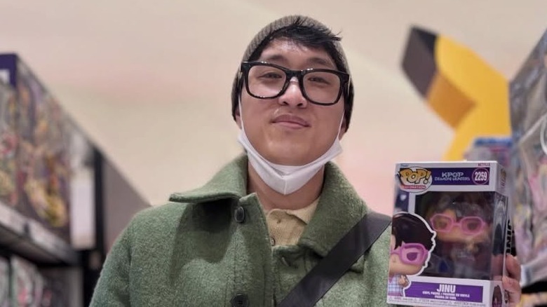 Andrew Choi holds Jinu funko pop