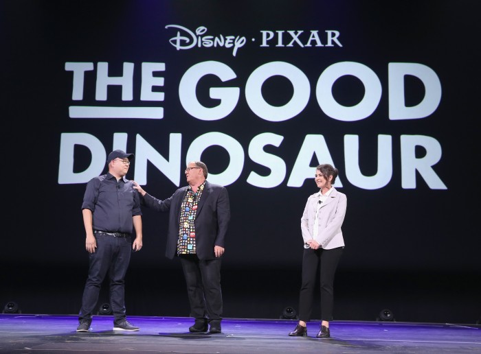 ANAHEIM, CA - AUGUST 14: Director Peter Sohn (L) and producer Denise Ream (R) of THE GOOD DINOSAUR with Chief Creative Officer of Walt Disney and Pixar Animation Studios John Lasseter (C) took part today in 