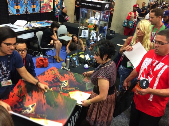 Kevin Tong signing his great Guardians of the Galaxy Rocket Raccoon print at the Mondo booth