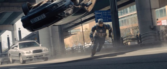 Avengers: Age of Ultron: Captain America runs as cars flip