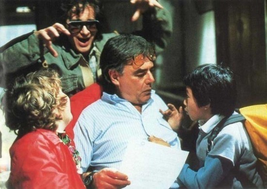Vintage set photo: Steven Spielberg trying to scare Richard Donner as he'stalking to Jeff Cohen and Jonathan Ke Quan on the set of The Goonies.