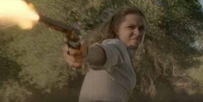 Dolores with a gun on a horse - westworld