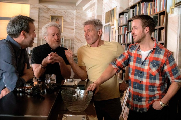 Denis Villeneuve, producer Ridley Scott, and stars Harrison Ford and Ryan Gosling on the set of BLADE RUNNER 2049