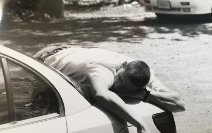 Our sound guy Jason Tower asleep on top of a car, we worked our crew too hard