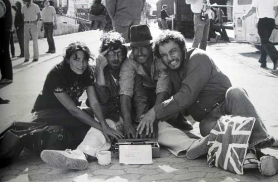 Vintage set photo: Karen Allen, Steven Spielberg, Harrison Ford and John Rhys-Davies working on rewrites of the script on the set of Raiders of the Lost Ark.