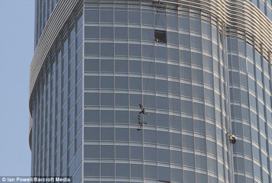 tom cruise sitting on top of dubai building